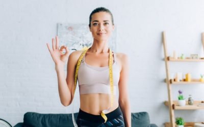 How to Lose Weight on a Budget and Busy Schedule 17 weight loss on a budget:Brunette sportswoman with measuring tape